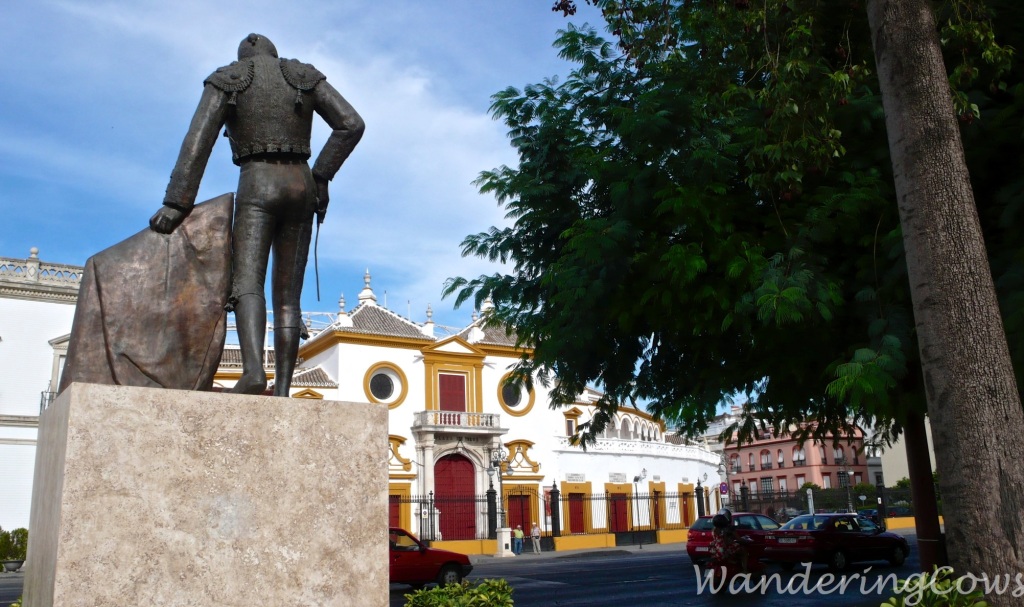 Seville bullring and bullfighter statue